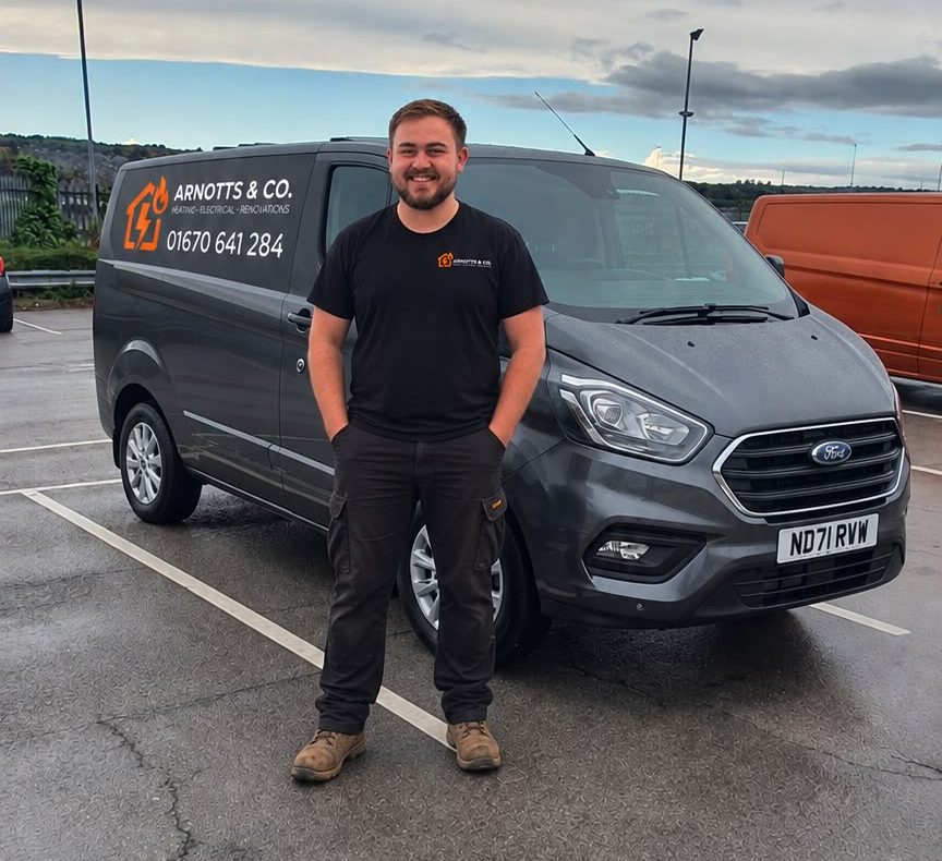 Tom Arnott, director and heating engineer, with an Arnotts & Co van